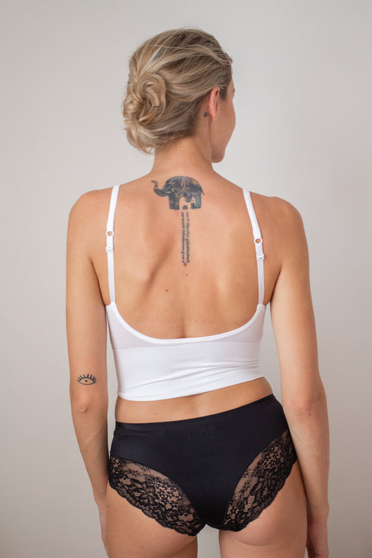 woman back facing wearing a black bralette