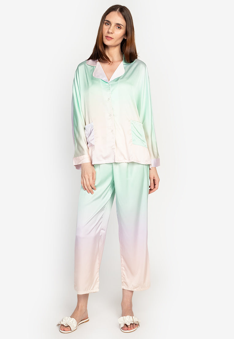 A woman wearing a silk long sleeve pajama set