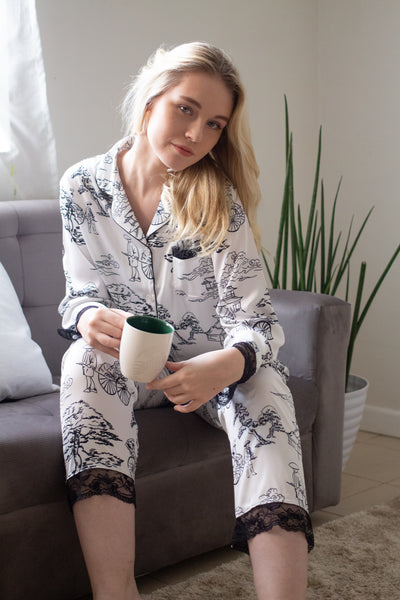 Woman sitting and wearing long sleeves top and pajama