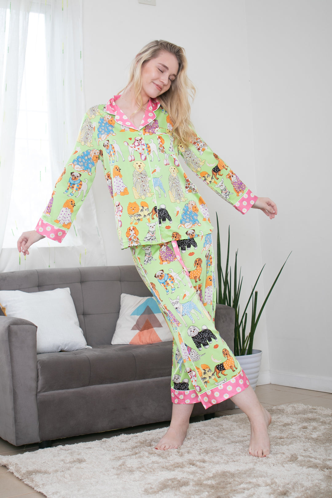 A woman standing and wearing silk long sleeve pajama set