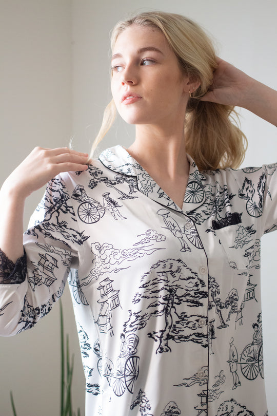Woman standing up and wearing long sleeves top