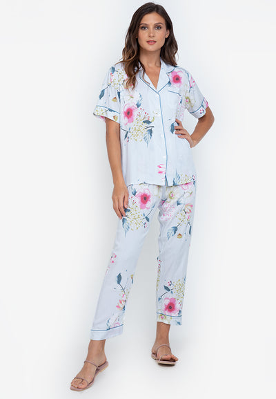 A woman standing and wearing cotton short sleeve pajama set