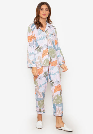 A woman wearing a cotton long sleeve pajama set