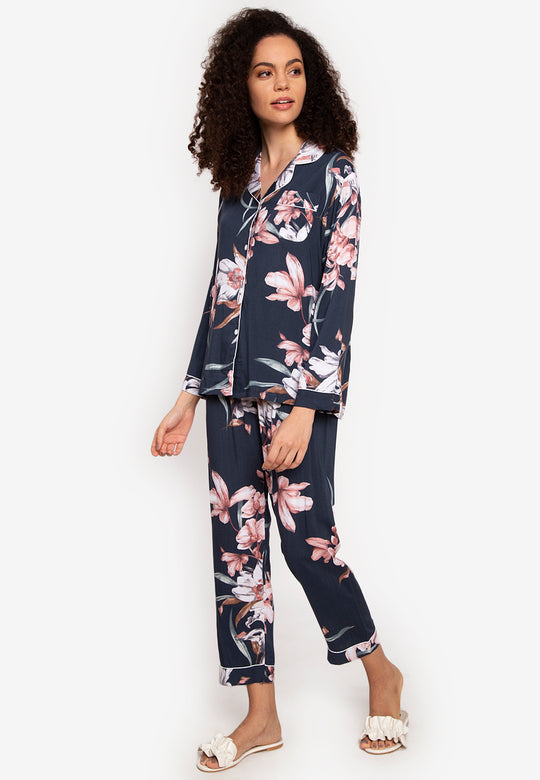 A woman wearing a cotton long sleeve pajama set