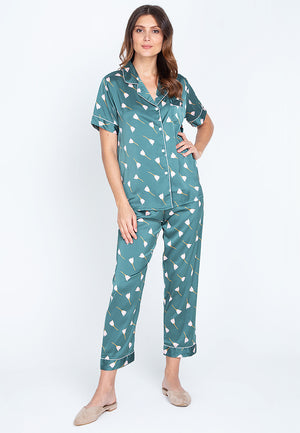 A woman standing and wearing Silk short sleeve pajama set