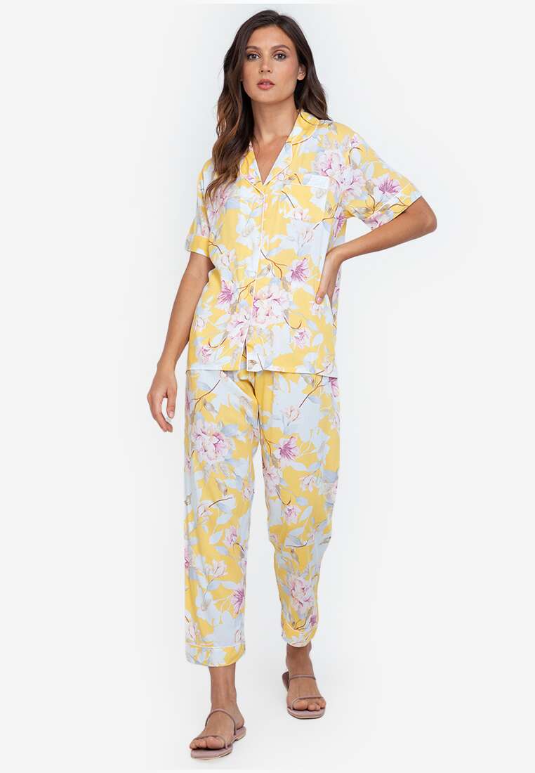 A woman wearing a cotton short sleeve pajama set