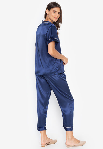 A woman wearing a Silk short sleeves Pajama Set