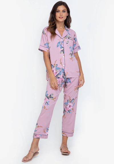 A woman standing and wearing a cotton shortsleeve pajama set
