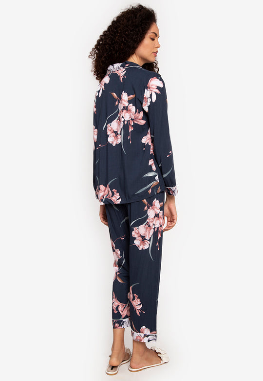 A woman wearing a cotton long sleeve pajama set