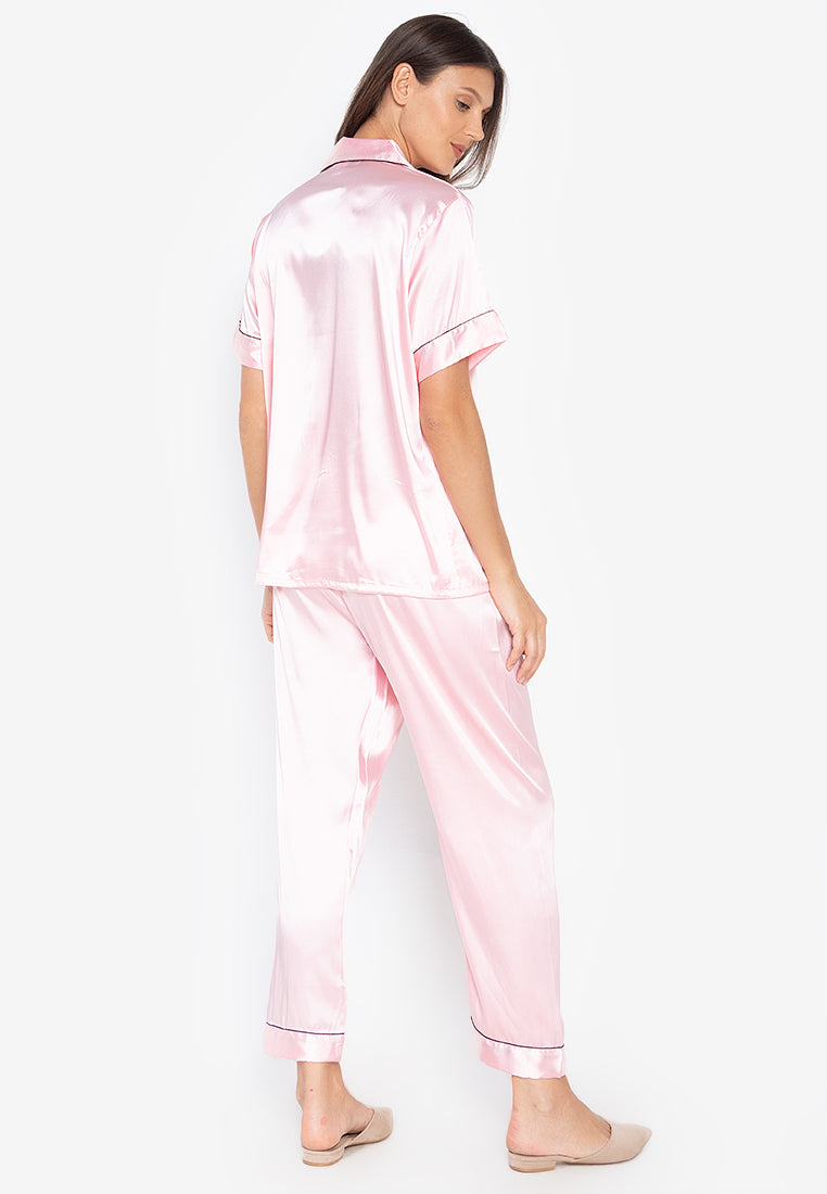 A woman wearing a Silk short sleeves Pajama Set