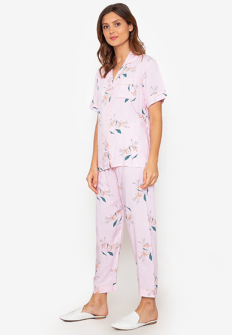 A woman wearing a short sleeve pajama set