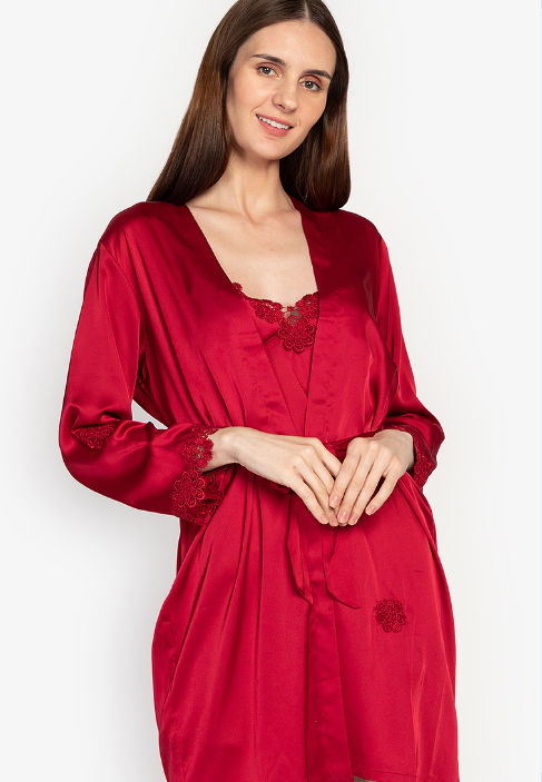 A woman wearing a laced robe, silk night dress