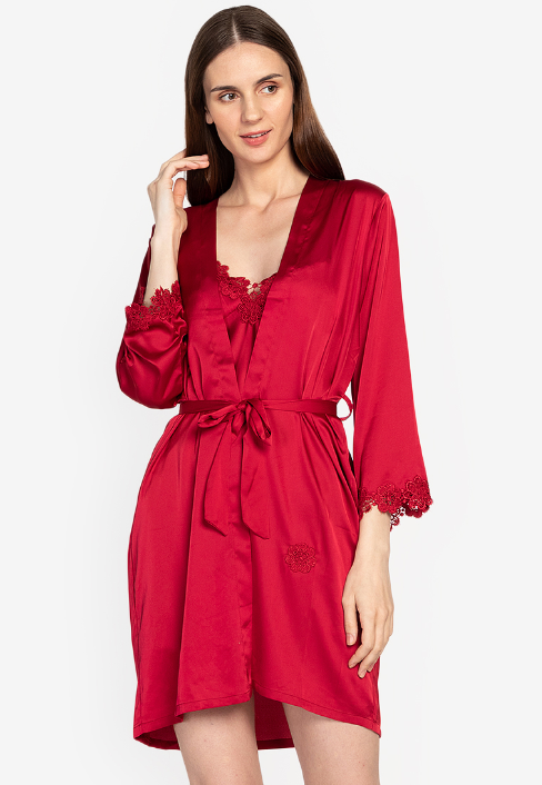 A woman wearing a laced robe, silk night dress