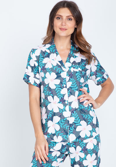 Woman wearing a floral shortsleeve and pajama