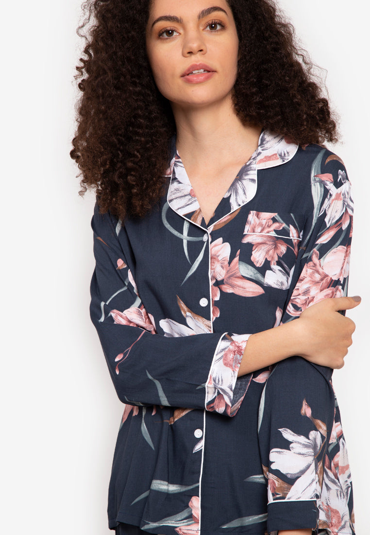 A woman wearing a cotton long sleeve pajama set