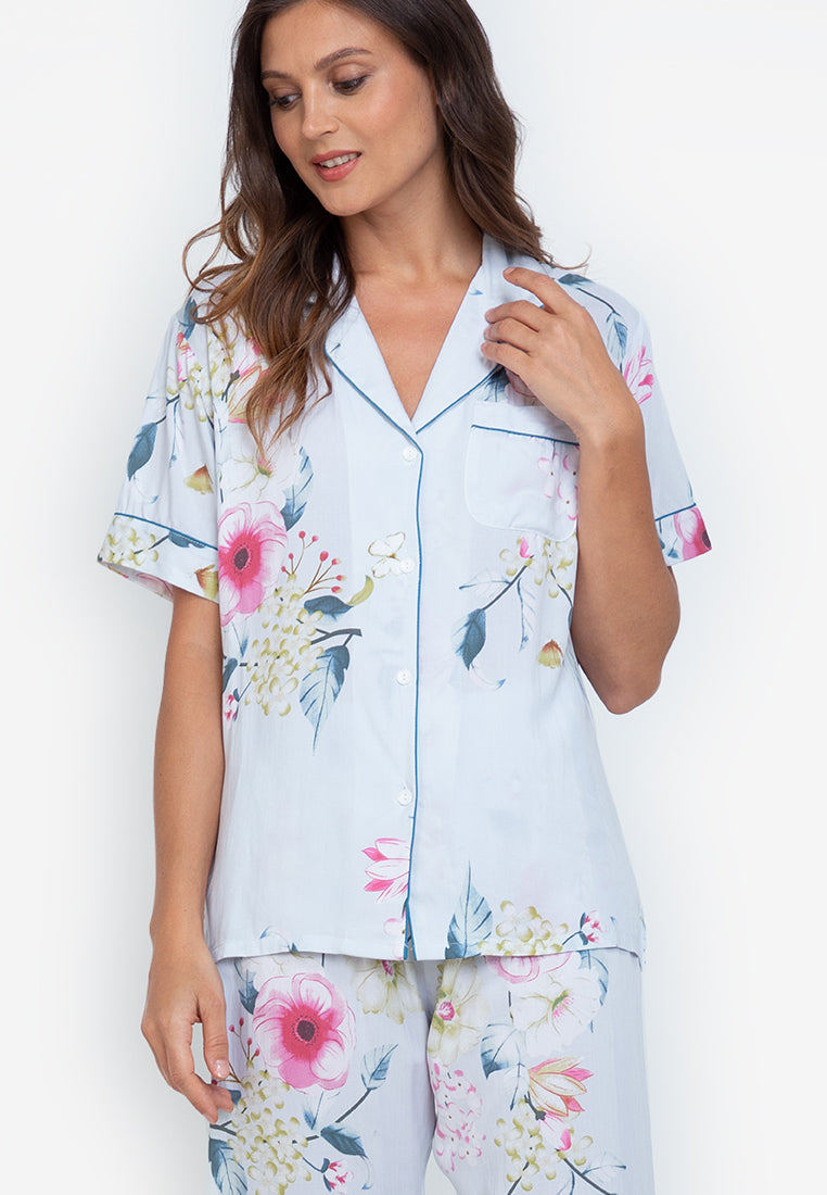 A woman standing and wearing cotton short sleeve pajama set