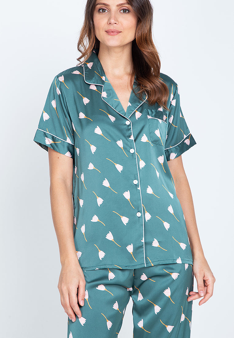 A woman standing and wearing Silk short sleeve pajama set