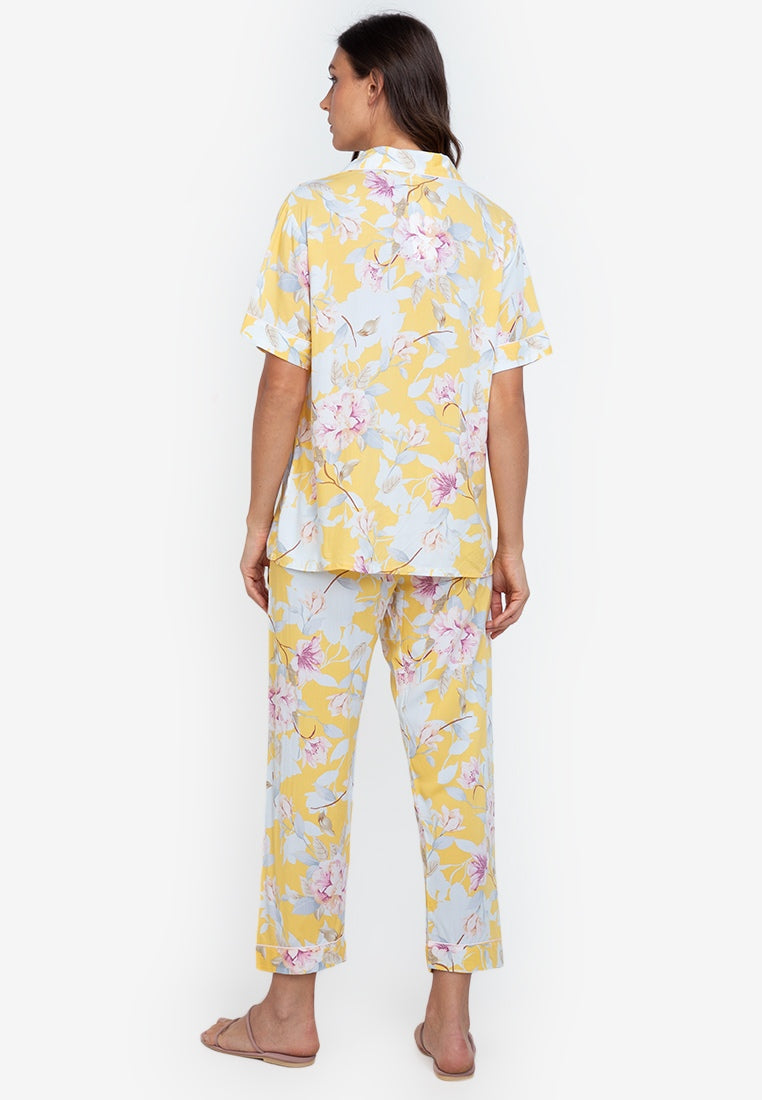 A woman wearing a cotton short sleeve pajama set