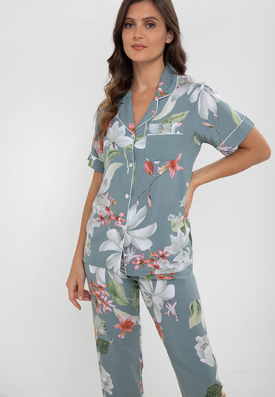 A woman standing and wearing a cotton short sleeve pajama set