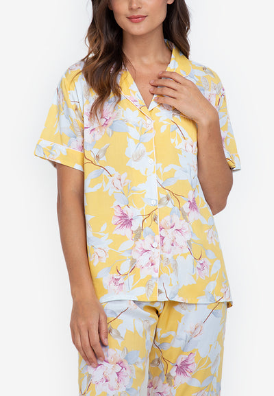A woman wearing a cotton short sleeve pajama set