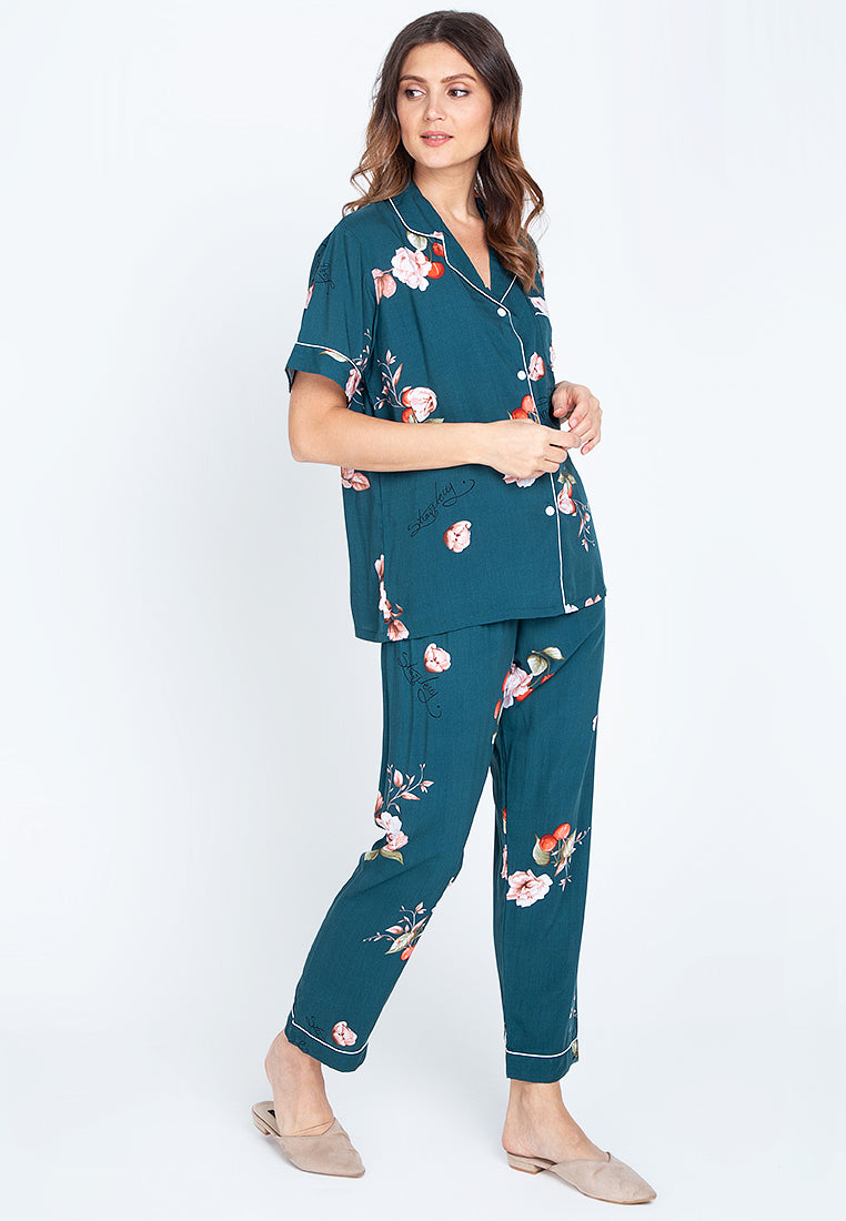 A woman standing and wearing cotton short sleeve pajama set