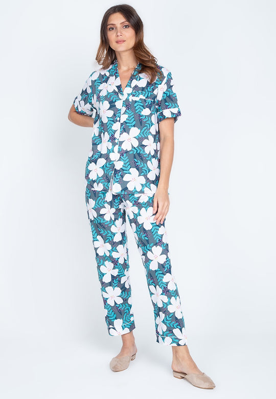 Woman wearing a floral shortsleeve and pajama