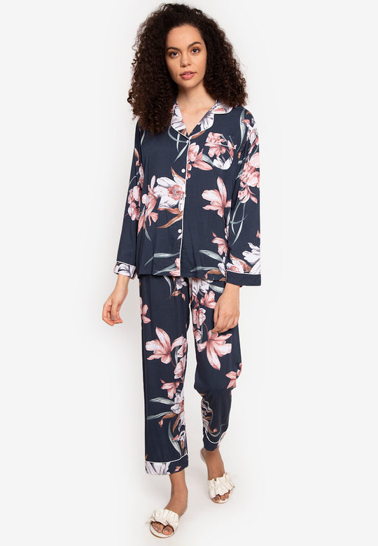 A woman wearing a cotton long sleeve pajama set