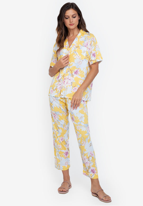 A woman wearing a cotton short sleeve pajama set