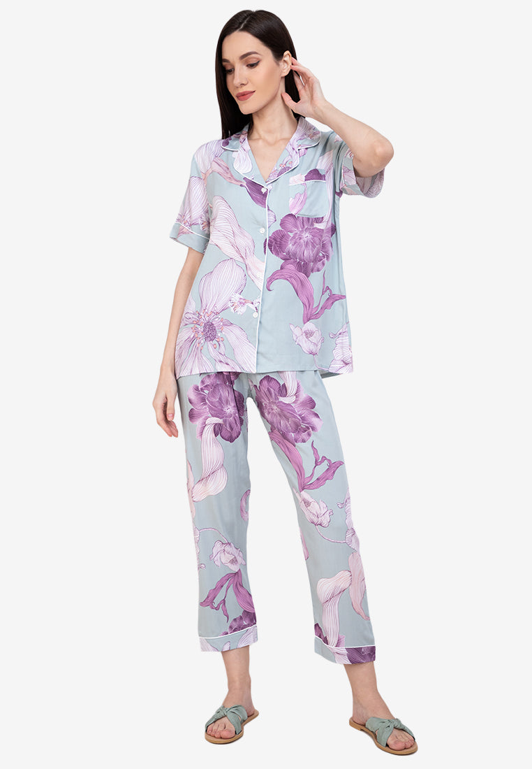 A woman wearing a cotton short sleeve pajama set