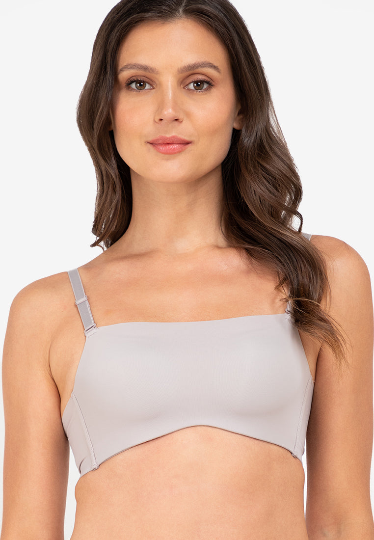 A woman standing and padded push-up bra