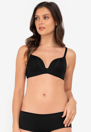 A woman standing and padded push-up bra