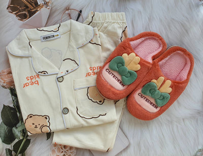 folded pajama set with complimentary slipper