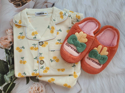 folded pajama set with complimentary slipper