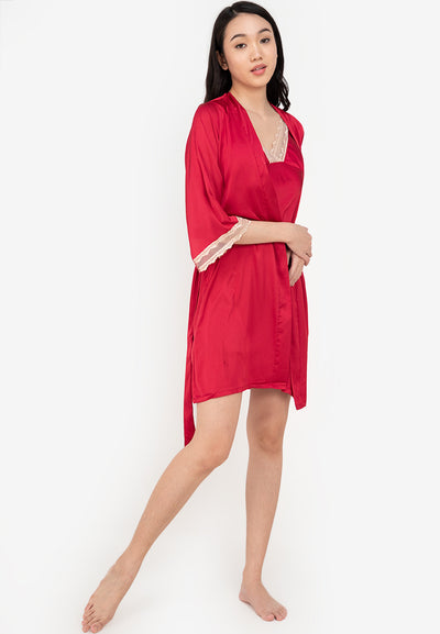 A woman wearing a slip dress in a robe